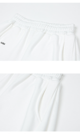 [mnem] ピンタックロゴジョガーパンツ (white)