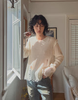 Reverse damage V-neck knitwear