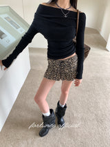 Black hole off-shoulder long-sleeved knitwear