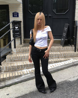 Black stitch boots cut pants