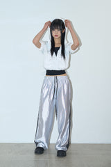 Bright glossy track pants