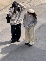 a light striped sweatshirt, grey