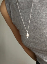 Matt conch symbol long necklace