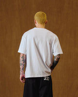 アンケージドスローガンTシャツ/ホワイト