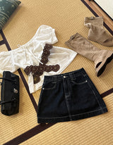 a raw paper stitch jean skirt