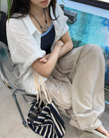Penan striped shoulder bag