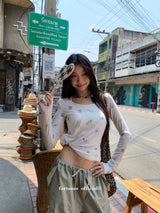 Item Span off shoulder long sleeve tee