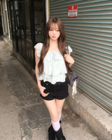 Eyelet belted shorts