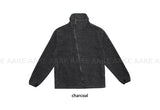 DIAGONAL HIGH-NECK ZIP-UP