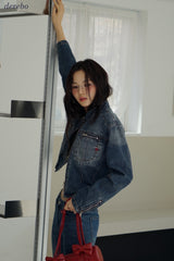 Round medium blue zip-up denim jacket