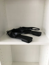 Twist belt slingback flat