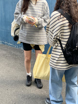 a light striped sweatshirt, grey