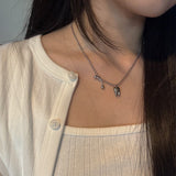 tooth piercing necklace