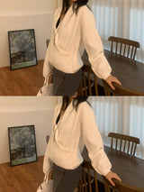 メリルーズフィットラップVネックヒドゥンスナップニットトップス