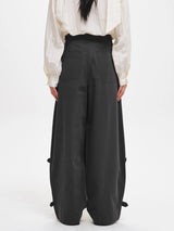 CURVED SEAM TUCKED WIDE PANTS