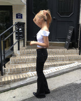 Black stitch boots cut pants