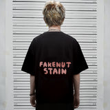フェイクナッツ ステイン メイド イン アスタリスク ブラック ボクシー オーバーサイズ Tシャツ