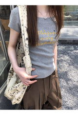 イエロークリームオフショルダーショートスリーブニットTシャツ