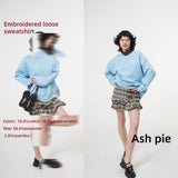 Smocked mini skirt with adjustable buckle