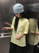 コゲ スター ミュージカル ノート プリンティング ルーズフィット ショートスリーブ ティー