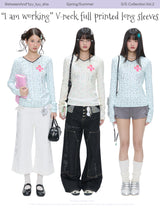 BETWEENAND「Music Box Melody」Spring: a loose-long-sleeved T-shirt with a V-neck and various prints, worn while working