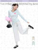 BETWEENAND「Music Box Melody」Spring: a loose-long-sleeved T-shirt with a V-neck and various prints, worn while working