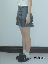Smocked mini skirt with adjustable buckle