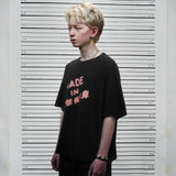 フェイクナッツ ステイン メイド イン アスタリスク ブラック ボクシー オーバーサイズ Tシャツ