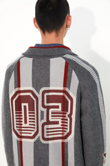 Loose lapel, raglan sleeve, color-blocked striped, cut-out printed sweater