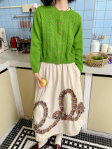 Round neck knitted cardigan sweater with regular shoulder and woolen fabric