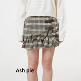 Smocked mini skirt with adjustable buckle