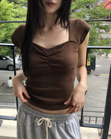 ハートネックパンチングキャップスリーブシャーリング半袖Tシャツ