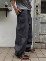 Node single-pleat raw denim jeans