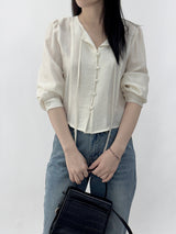Leche Strap Button Long Sleeve Blouse