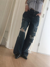 Dirty washed destroyed denim pants