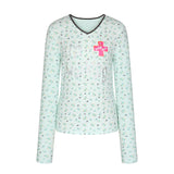 BETWEENAND「Music Box Melody」Spring: a loose-long-sleeved T-shirt with a V-neck and various prints, worn while working