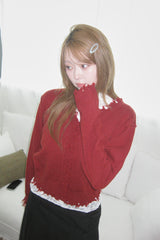 Rough damaged cardigan