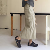 Abe nylon string cargo back banding long skirt
