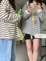 a light striped sweatshirt, grey