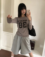 ネルズナンバープリントワンオフショルダー長袖Tシャツ