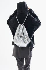 Metallic panel drawstring backpack