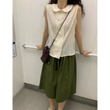 burring sleeveless blouse