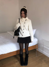 ジュークディアゴナルボタンハイネックニット