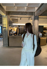 Flower brooch striped long-sleeved knit shirt