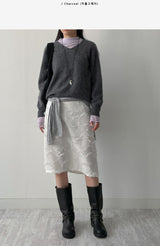 Raccoon V-neck loose-fit knit