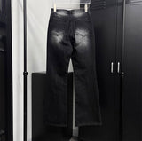 Black cat washing boots cut pants