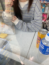 a light striped sweatshirt, grey