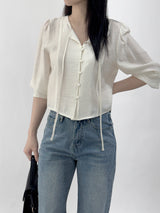 Leche Strap Button Long Sleeve Blouse