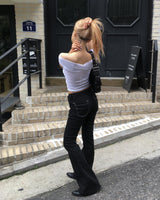 Black stitch boots cut pants