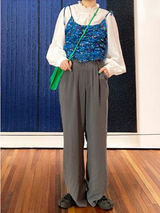 Black loose straight-leg suit pants with a drape effect